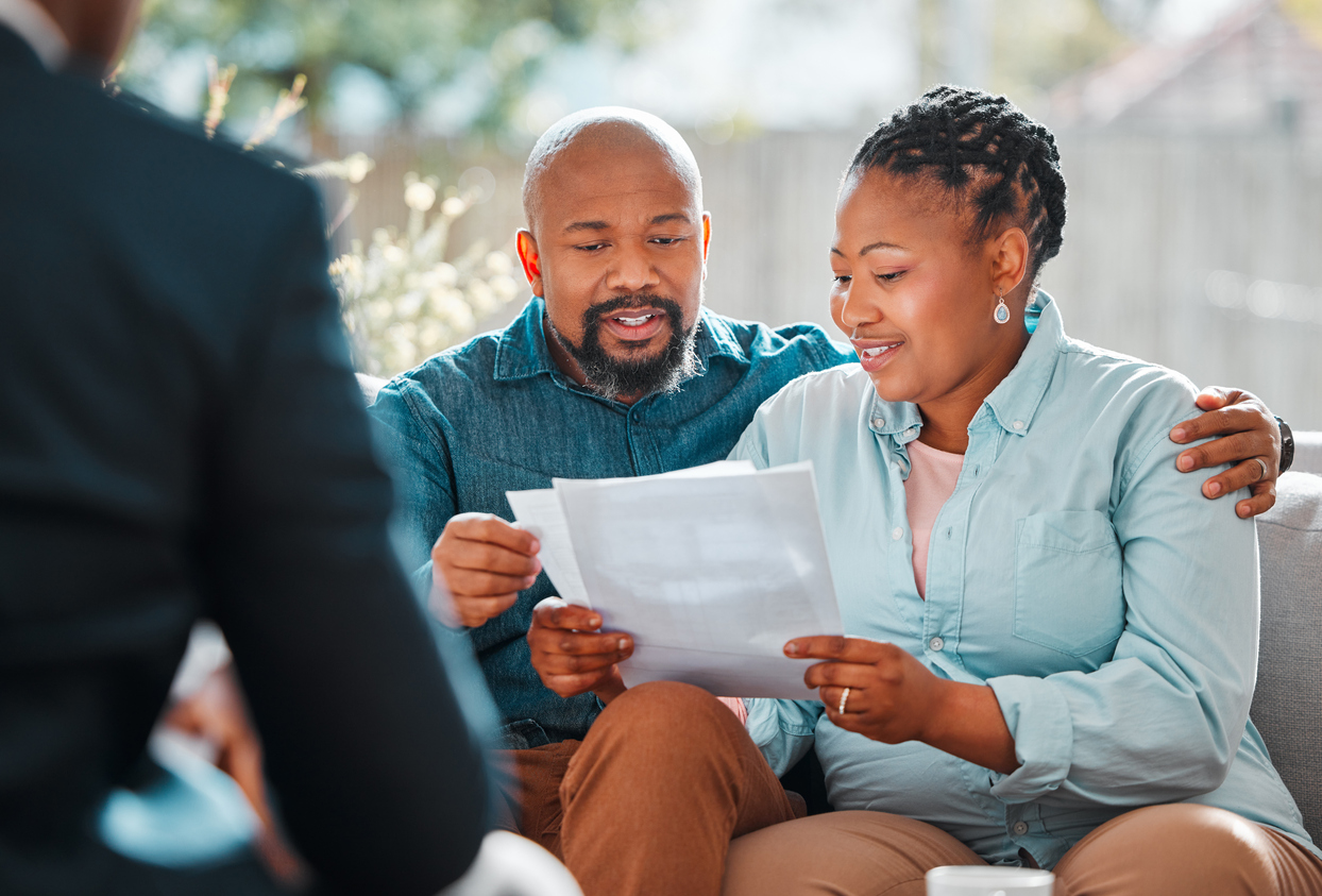 Shot of a mature couple meeting with their insurance agent
